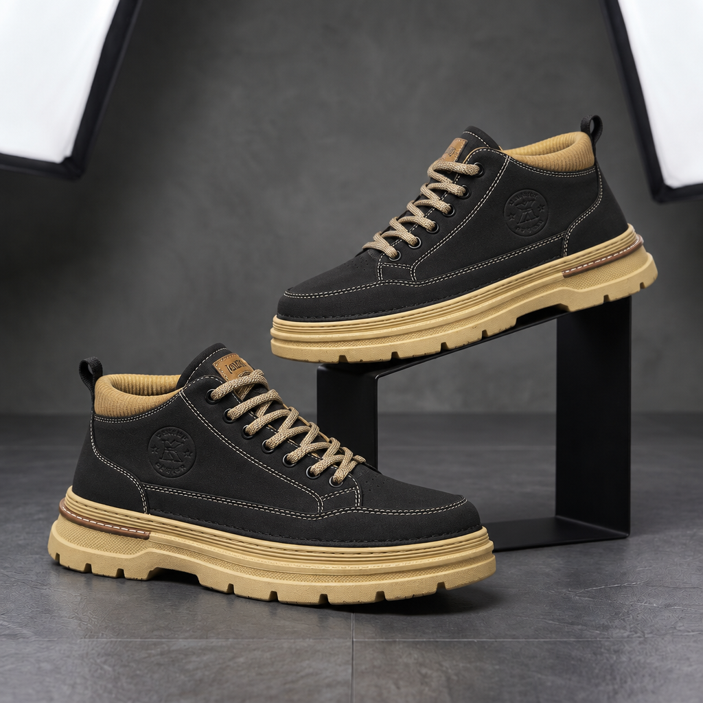 Pair of Langley Cushioned Chukka Boots in black on a studio display stand