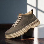 Langley Cushioned Chukka Boot in khaki, side view on a wooden floor