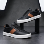 Pair of Sullivan Court Sneakers in black on a studio display stand